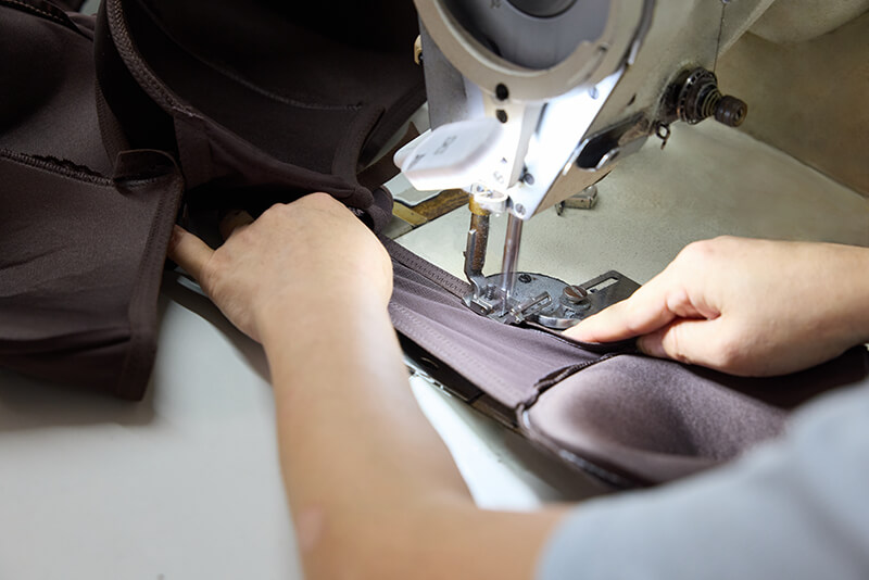 Close-up of garment sewing machinery